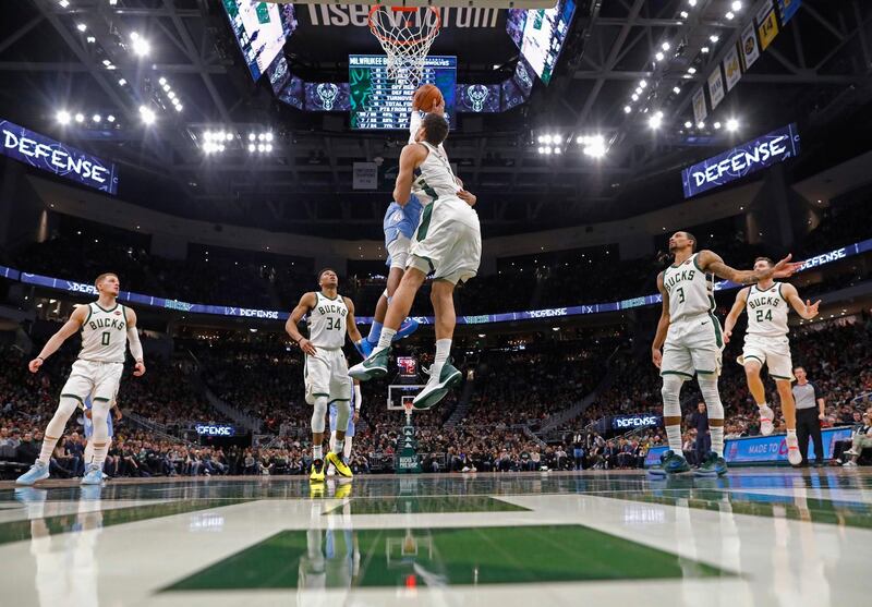 Milwaukee Bucks' Brook Lopez blocks a shot by Josh Okogie of the Minnesota Timberwolves during the second half of their NBA game on Wednesday, January 1. AP