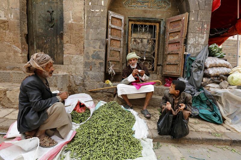 People sit at a market in the old city of Sanaa, Yemen.  EPA