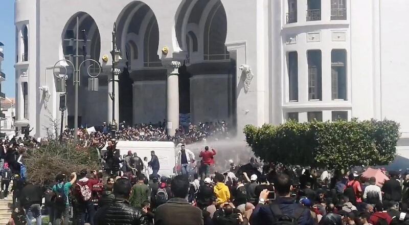 Police officers use water cannon to disperse people protesting after parliament appointed upper house chairman Abdelkader Bensalah as interim president in Algiers, Algeria. Reuters