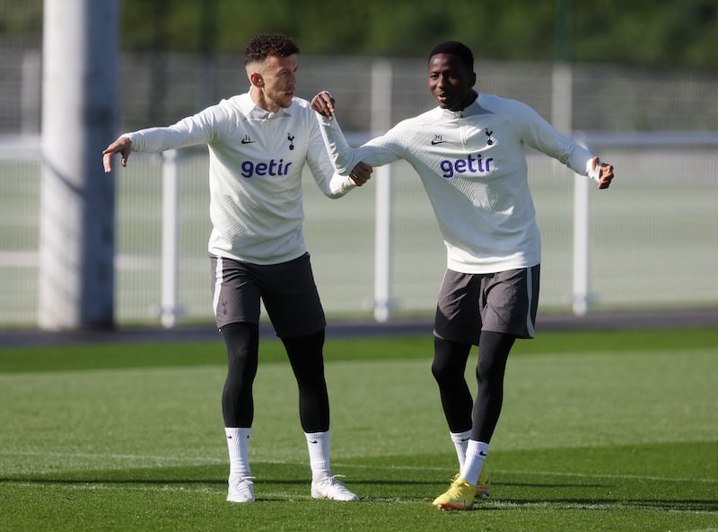 Tottenham Hotspur's Pape Matar Sarr and Ivan Perisic during training. Reuters