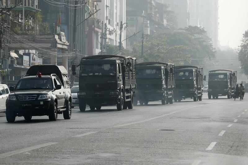 Armoured vehicles drive along a road in Yangon, Myanmar. EPA