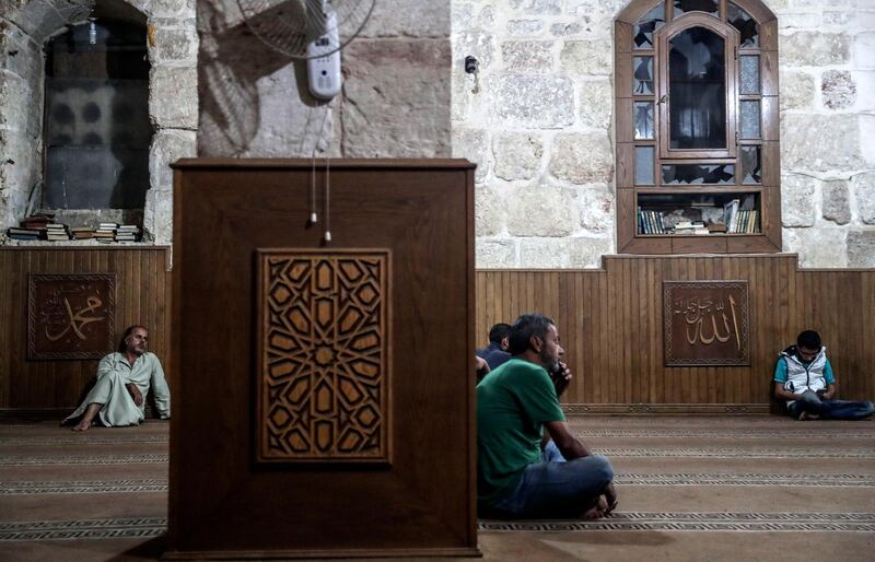 Men gather at the Great Mosque of Maarrat al-Numan during Laylat Al Qadr in Idlib, Syria, on June 11, 2018. Mohammed Badra / EPA