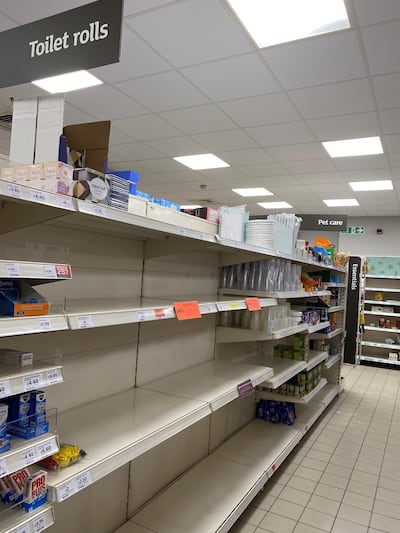Empty shelves from a Sainsbury's supermarket in London, UK, as shoppers in the British capital stockpile goods in advance of strict lockdown measures to fight coronavirus. Toilet roll is in particularly short supply. Emma Sky for The National