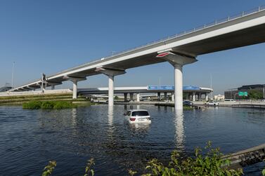 Many cars were abandoned during the heavy rains after roads became waterlogged. Antonie Robertson / The National