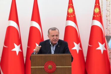 Turkey's President Recep Tayyip Erdogan speaks during an event in Ankara, Turkey, Saturday, May 8, 2021. In a speech after the breaking of Ramadan fast late Saturday, Erdogan, has strongly condemned violence in Jerusalem. On Friday, more than 200 Palestinians were wounded in clashes at the Al-Aqsa Mosque compound and elsewhere in Jerusalem, drawing condemnations from Israel's Arab allies and calls for calm from the United States, Europe and the United Nations. (Turkish Presidency via AP)