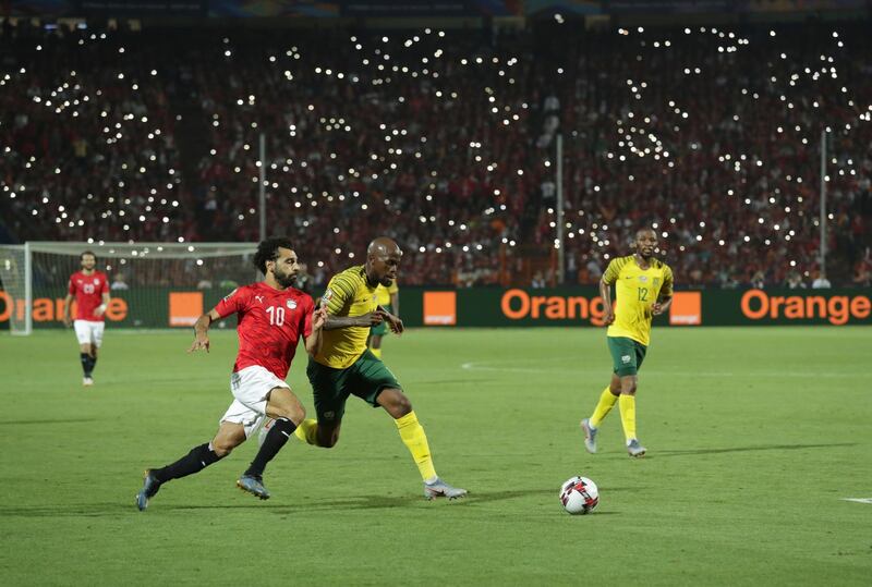 Egypt's Mohamed Salah, left, and South Africa's Sandile Hlanti run for the ball. AP Photo