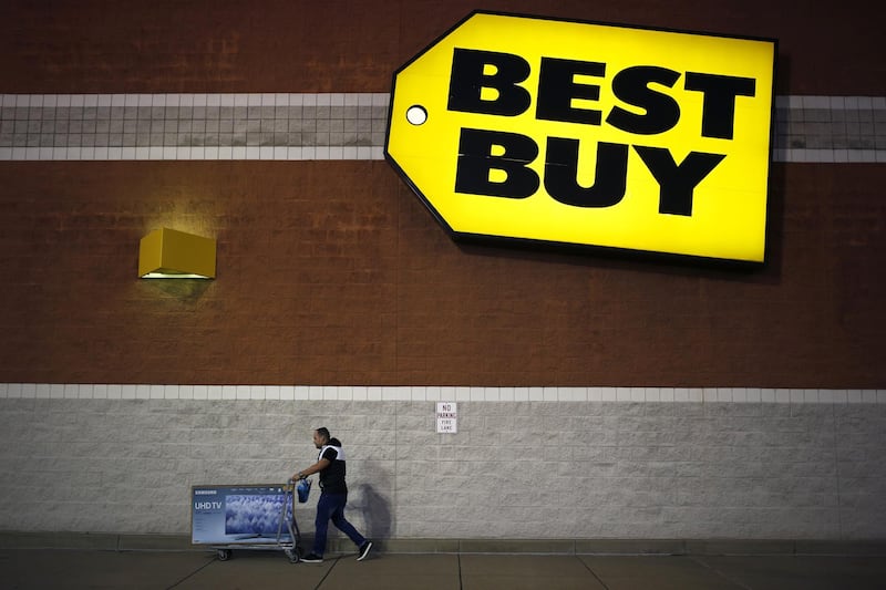A shopper wheels away big screen television outside a Best Buy store in Louisville, Kentucky. Luke Sharrett / Bloomberg