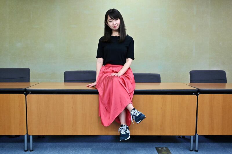 Yumi Ishikawa, leader and founder of the KuToo movement, poses after a press conference in Tokyo on June 3, 2019. - A group of Japanese women on June 3 submitted a petition to the government to protest what they say is a de-facto requirement for female staff to wear high heels at work. The online campaign #KuToo, using a pun from a Japanese word "kutsu" -- that can mean either "shoes" or "pain" --  was launched by actress and freelance writer Yumi Ishikawa and quickly won support from nearly 19,000 people online. (Photo by Charly TRIBALLEAU / AFP)