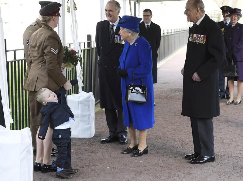 Michelle Lun and her two-year-old son Alfie meet Britain’s Queen Elizabeth II at the unveiling of a national memorial in London. The memorial honours the armed forces and civilians who served their country during the Gulf War, and conflicts in Iraq and Afghanistan. Britain’s Prince Philip stands at right. Toby Melville / AP / March 9, 2017