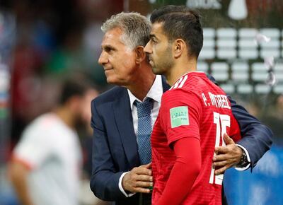 epa06825781 Iran's coach Carlos Queiroz (L) and his player Pejman Montazeri react after the FIFA World Cup 2018 group B preliminary round soccer match between Iran and Spain in Kazan, Russia, 20 June 2018. Iran lost the match 0-1.
(RESTRICTIONS APPLY: Editorial Use Only, not used in association with any commercial entity - Images must not be used in any form of alert service or push service of any kind including via mobile alert services, downloads to mobile devices or MMS messaging - Images must appear as still images and must not emulate match action video footage - No alteration is made to, and no text or image is superimposed over, any published image which: (a) intentionally obscures or removes a sponsor identification image; or (b) adds or overlays the commercial identification of any third party which is not officially associated with the FIFA World Cup)  EPA/ROBERT GHEMENT   EDITORIAL USE ONLY
