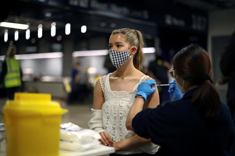 A woman receives a Covid-19 vaccination in London, England