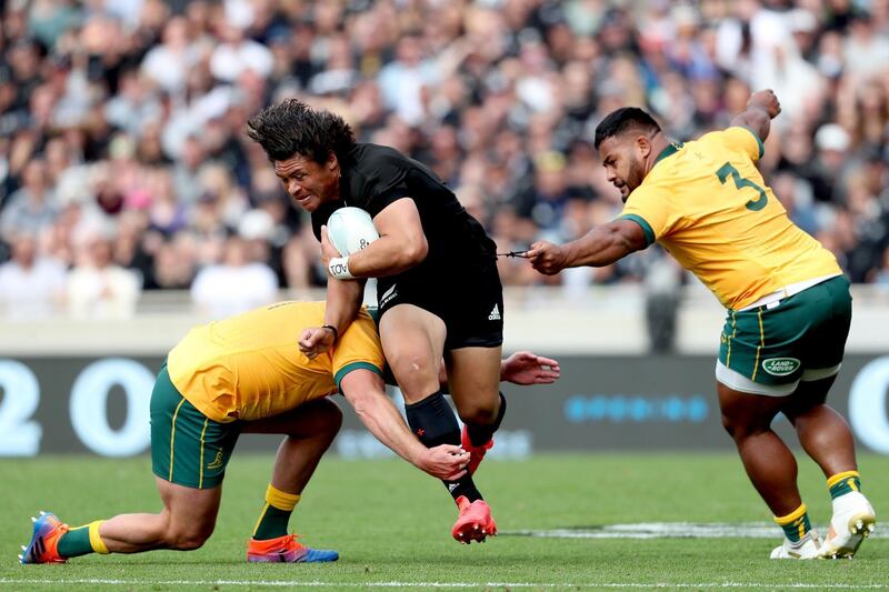 Australia's James Slipper and Taniela Tupou tackle New Zealand's Caleb Clarke. AFP