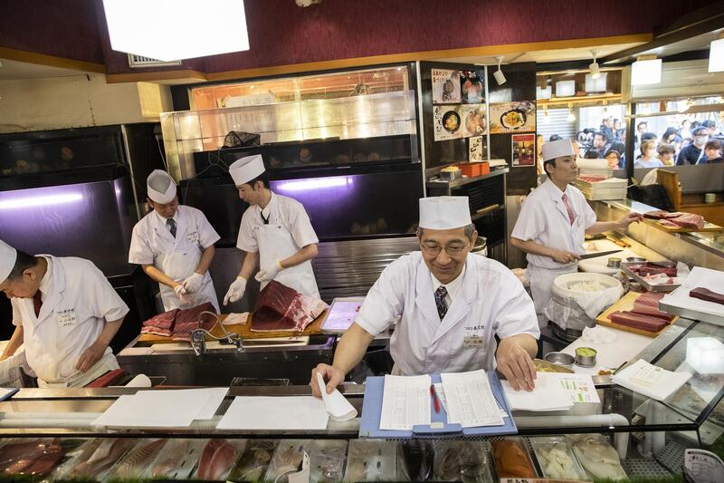 Employees work at a Sushizanmai restaurant, operated by Kiyomura Corp., in Tokyo, Japan. Bloomberg