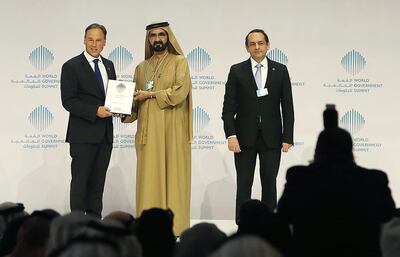DUBAI , UNITED ARAB EMIRATES – Feb 09 , 2016 : Sheikh Mohammed Bin Rashid Al Maktoum , Vice President and Prime Minister of UAE and Ruler of Dubai giving best minister in the world award to Greg Hunt , Minister of Environment , Australia at the World Government Summit held at Madinat Jumeirah in Dubai.  ( Pawan Singh / The National ) For News. Story by Caline Malek. ID no. 52164
 *** Local Caption ***  PS0902- GOVT SUMMIT38.jpg