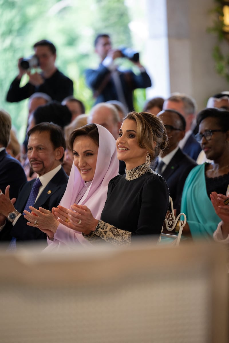Princess Rajwa's mother, Azza Al Sudairi, and Queen Rania applaud the newlyweds. Reuters