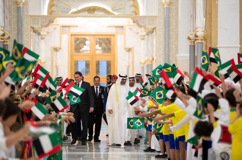 Sheikh Mohamed bin Zayed, Crown Prince of Abu Dhabi and Deputy Supreme Commander of the UAE Armed Forces, meets Jair Bolsonaro, President of Brazil, at the Presidential Palace in Abu Dhabi on Sunday. Courtesy Sheikh Mohamed bin Zayed Twitter