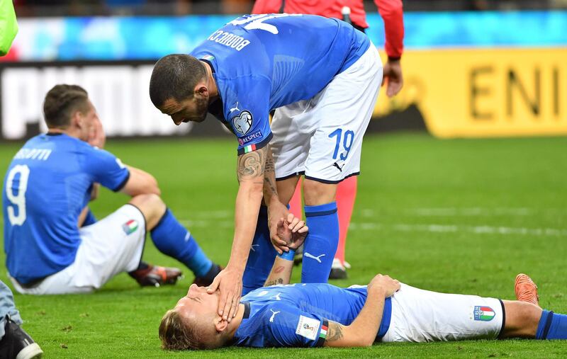 epa06327562 Italy's defender Leonardo Bonucci and teammate forward Ciro Immobile show their dejection at the end of the FIFA World Cup 2018 qualification playoff second leg soccer match between Italy and Sweden at the Giuseppe Meazza stadium in Milan, Italy, 13 November 2017. Sweden won 1-0 on aggregate.  EPA/DANIEL DAL ZENNARO