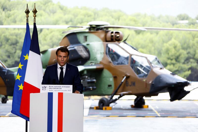 French President Emmanuel Macron delivers a speech from a helicopter carrier. EPA