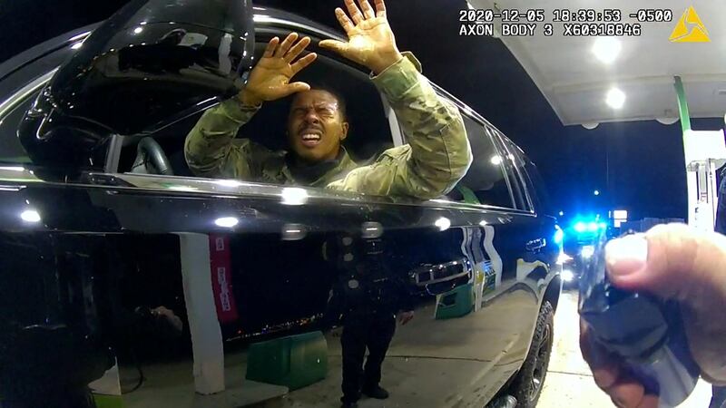 A body camera image of US Army 2nd Lt Caron Nazario holding up his hands after being sprayed with a chemical agent by a police officer, during an incident at a petrol station, in Windsor, Virginia, US. Reuters