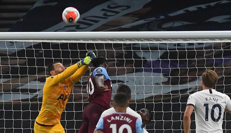 Tottenham goalkeeper Hugo Lloris  in action against Michail Antonio of West Ham. EPA
