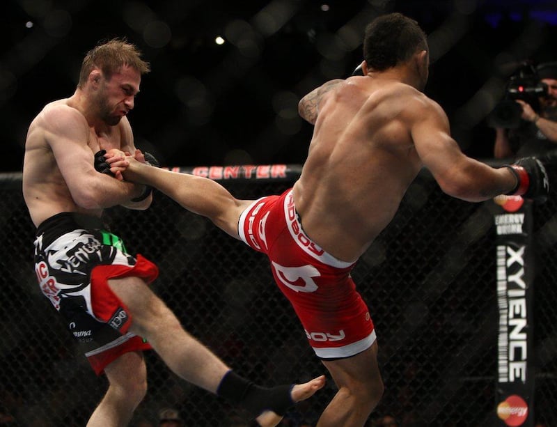 John Lineker, right, and Ali Bagautinov fight during their flyweight bout on Saturday. Bagautinov won by unanimous decision. Tim Larsen / AP