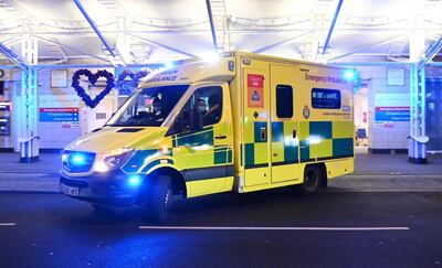 epa08925320 An ambulance outside Chelsea and Westminster hospital in London, Britain, 07 January 2021. Britain's national health service (NHS) is coming under sever pressure as Covid-19 hospital admissions continue to rise across the UK.  EPA/ANDY RAIN