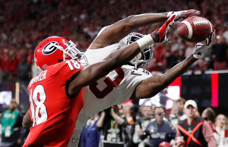 Georgia's Deandre Baker knocks the ball away from Alabama's Calvin Ridley during the second half of the NCAA college football playoff championship game in Atlanta. David Goldman / AP Photo