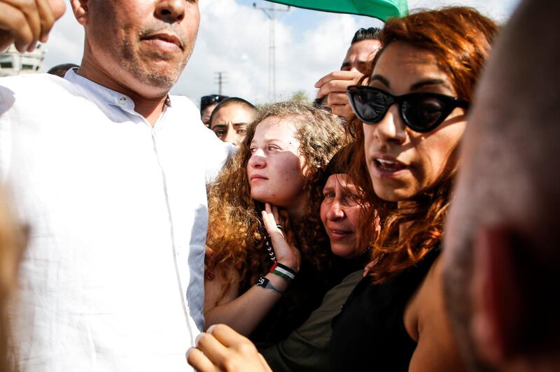Ahed Tamimi was surrounded by supporters upon her release. AFP