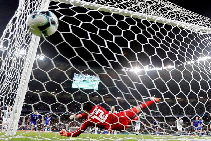 Argentina's Lionel Messi scores from the penalty spot. EPA