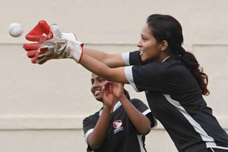 DUBAI, UNITED ARAB EMIRATES - December 14, 2012- UAE National Women's Cricket team wicket keeper Dipanki Borkar makes a catch during a practice session at the Sharjah Cricket Stadium in Sharjah City, Sharjah December 14, 2012. (Photo by Jeff Topping/The National)