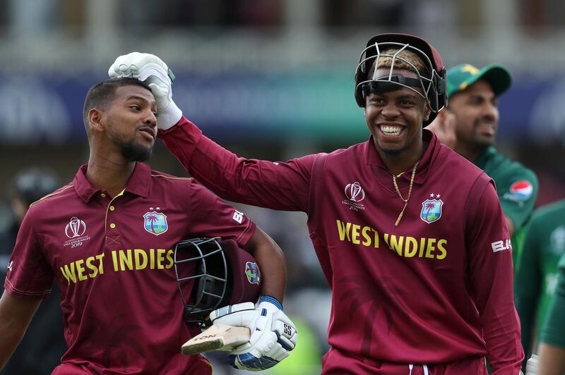 West Indies' Nicholas Pooran, left, and teammate Shimron Hetmyere leave the field after beating Pakistan. AP Photo