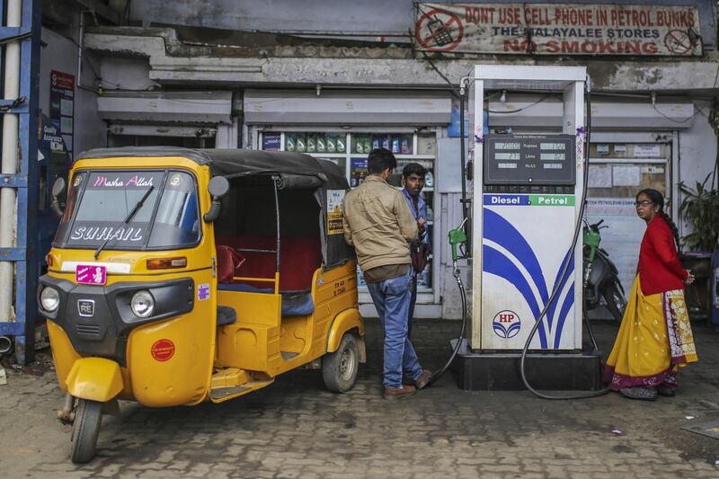 An auto-rickshaw sits parked at a Hindustan Petroleum Corp. gas station in Coonoor, Tamil Nadu, India, on Thursday, June 7, 2018. Most Asian markets were in the red on June 18 as concern that the row between U.S. and China may turn into a full-blown trade war. Most Asian markets were in the red on June 18 as concern that the row between U.S. and China may turn into a full-blown trade war. Photographer: Dhiraj Singh/Bloomberg