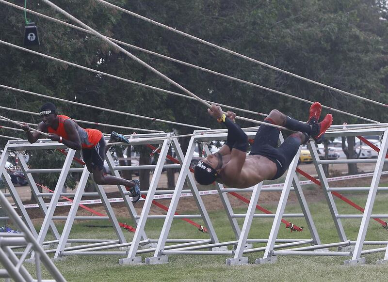 Elite super participants tackle the tyro traverse in the XDubai Spartan Race at Al Ghazal Golf Club in Abu Dhabi. Ravindranath K / The National / February 24, 2017