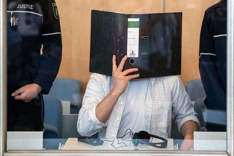 (FILES) In this file photo taken on June 7, 2019 defendant Sief Allah H. holds a folder in front of his face at the start of his trial on June 7, 2019 at a court in Duesseldorf, western Germany.   A German court sentenced a 31-year-old Tunisian to ten years in prison on March 26, 2020 for planning a foiled biological bomb attack with the deadly poison ricin. - Germany OUT
 / AFP / dpa / Federico Gambarini
