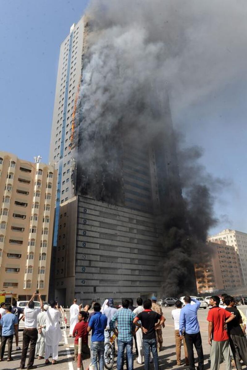 Fire engulfs Abdul Naser building, a 32-storey residential tower, on King Faisal Street in Sharjah on Thursday. AFP