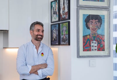 Evelyn Ashamallah's paintings are displayed perpendicularly against the smaller acrylic on aluminum pieces by Ehsan Arjmand. Leslie Pableo for The National