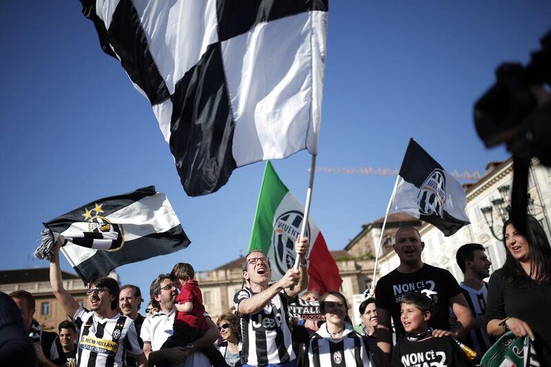 Juventus supporters celebrate the club's Serie A championship on Sunday. Marco Bertorello / AFP / May 4, 2014