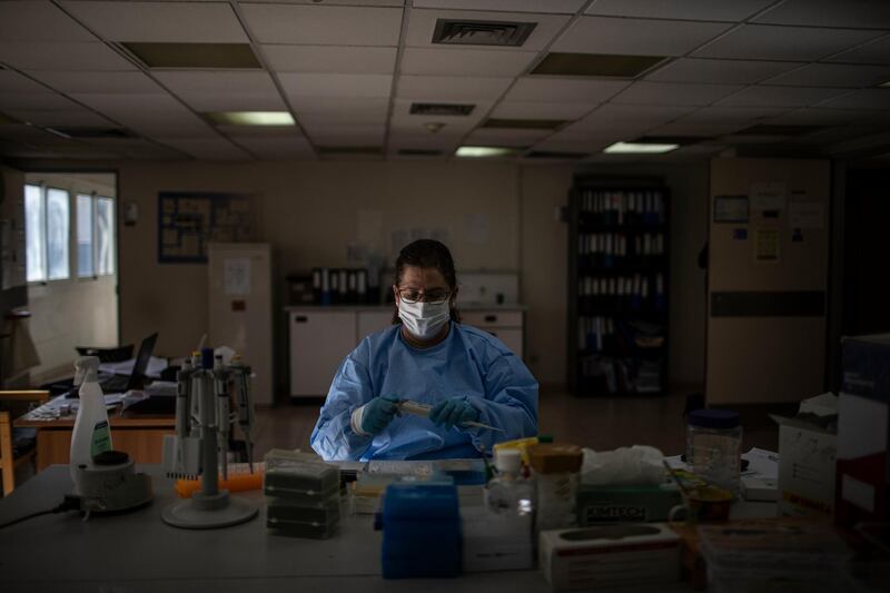 A Lebanese doctor conducts PCR test results inside the laboratory of the Rafik Hariri University Hospital. Getty Images