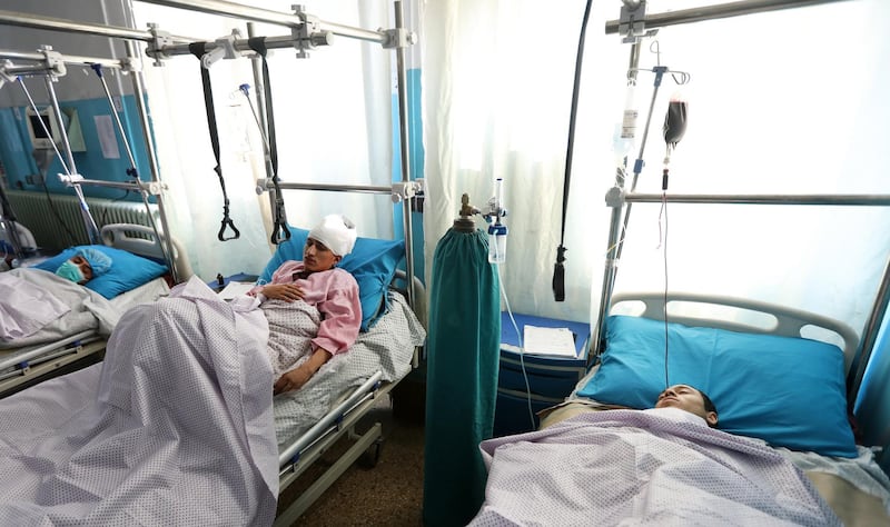 epa08832352 Three injured young men lay in bed at a hospital after several rockets targeted the downtown in Kabul, Afghanistan, 21 November 2020. According to media reports at least five  person were killed and 15 others wounded as several rockets landed on the Afghanistan capital.  EPA/JAWAD JALALI