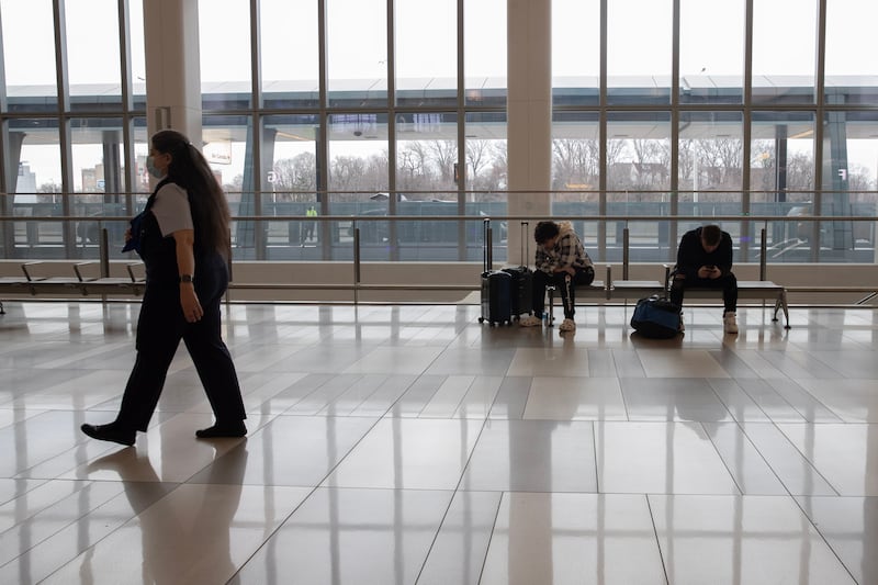 People wait at LaGuardia Airport in New York. EPA 