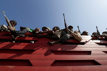 FILE PHOTO: Militia members from Ethiopia's Amhara region ride on their truck as they head to face the Tigray People's Liberation Front (TPLF), in Sanja, Amhara region near a border with Tigray, Ethiopia November 9, 2020. REUTERS/Tiksa Negeri/File Photo