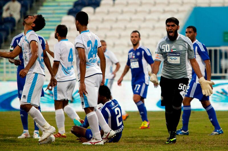 Abu Dhabi, United Arab Emirates, November 9, 2012:    Al Nasr's goalkeeper Abdualla Moosa reacts to being kicked by a Bani Yas player during their Pro League match at Baniyas Stadium in Abu Dhabi on November 9, 2012. Christopher Pike / The National