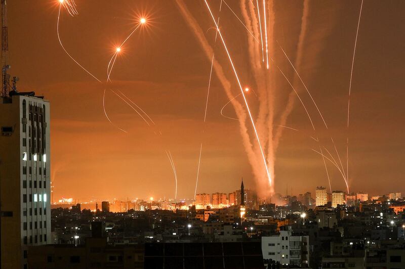 Rockets fired towards Israel from Beit Lahia in northern Gaza on Friday. Israel massed troops on the border as barrages were fired by both sides. AFP / Mohammed Abed
