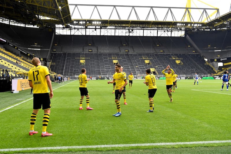 Dortmund's Erling Haaland, left, celebrates after scoring the opening goal. AP