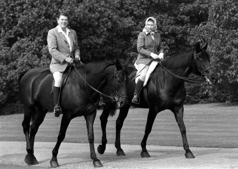Former US president Ronald Reagan with Queen Elizabeth in Windsor Home Park while staying as a guest of the queen. PA Photo