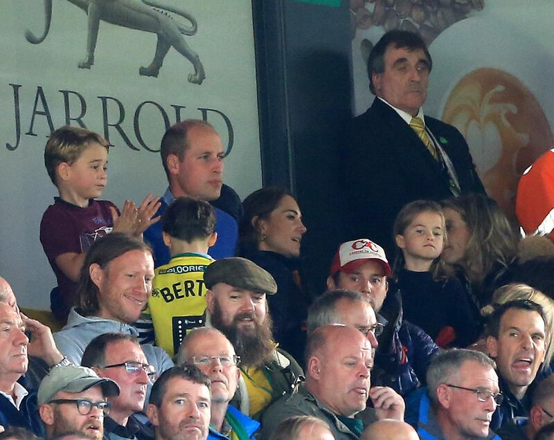 Prince George, Prince William, Duke of Cambridge and Catherine, Duchess of Cambridge and Princess Charlotte of Cambridge are seen in the stands. Getty Images