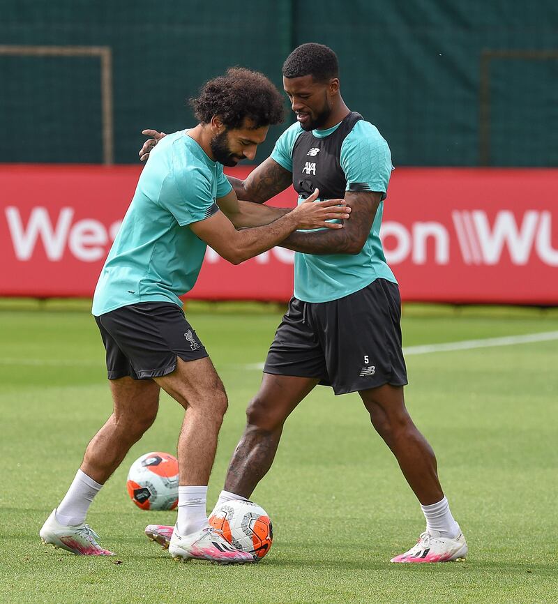LIVERPOOL, ENGLAND - JULY 24: (THE SUN OUT. THE SUN ON SUNDAY OUT) Mohamed Salah of Liverpool with Georginio Wijnaldum of Liverpool during a training session  at Melwood Training Ground on July 24, 2020 in Liverpool, England. (Photo by John Powell/Liverpool FC via Getty Images)