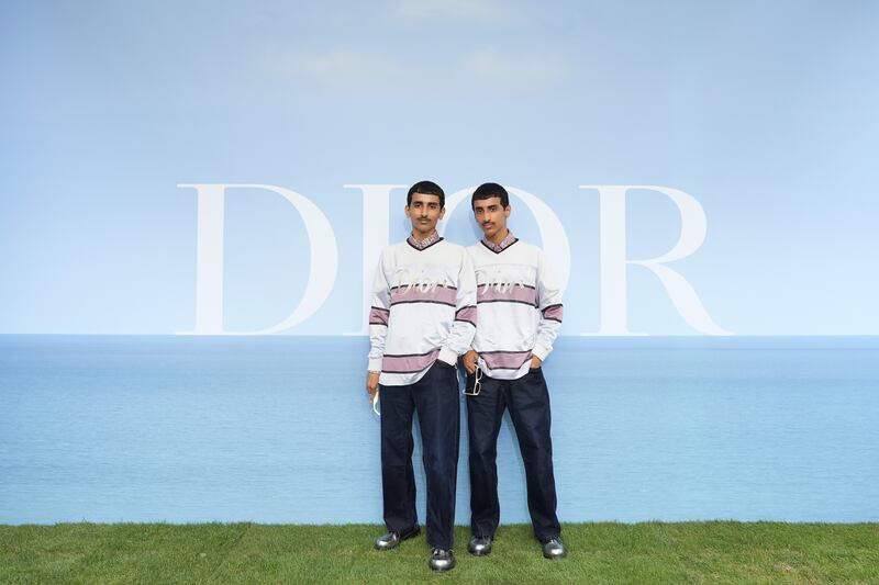 The Emirati Hadban twins attend the Dior Homme photocall. Getty Images For Christian Dior