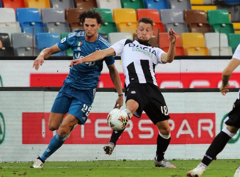 Juventus' Adrien Rabiot, left, and Udinense's Hidde Ter Avest clash. AP