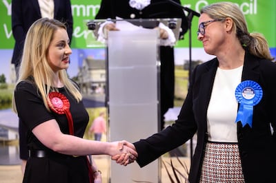 Labour Party candidate Gen Kitchen with Conservative Party candidate Helen Harrison after the Wellingborough by-election. Getty Images 
